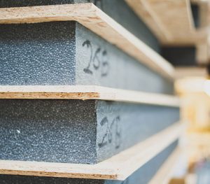 We laminate the OSB3 skins and EPS foam together to form SIPs using polyurethane glue and leave to cure under pressure in our press